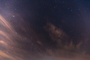 Real Night Sky Stars. Colorful Starry Sky With Some Clouds Background Backdrop