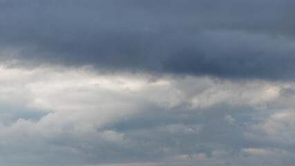 Dark heavy clouds in the sky, dramatic sky with dark storm clouds