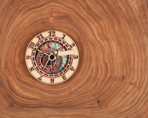 clock with abstract dial on wooden background