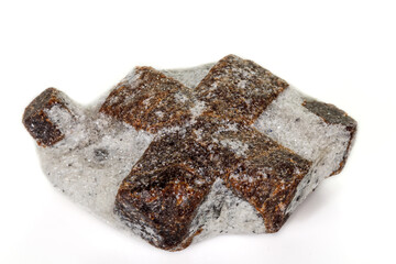 macro mineral stone Staurolite on a white background