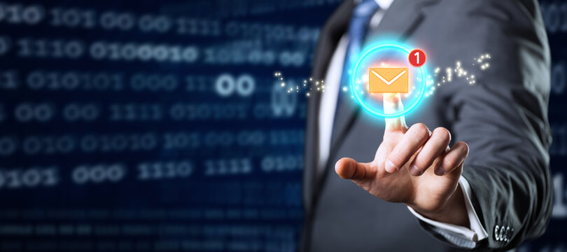 businessman touching an email icon on abstract blue background