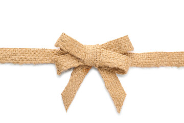 Burlap ribbon with pretty bow on white background, top view