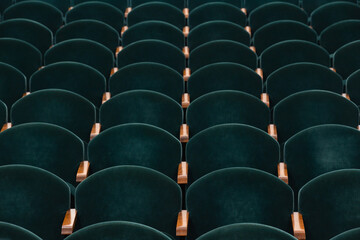 Obraz premium rows of soft velvet armchairs in the theater auditorium
