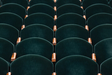 Obraz premium rows of soft velvet armchairs in the theater auditorium