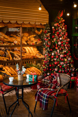 Fototapeta na wymiar Beautiful outdoor cafe with festive decoration. Christmas celebration