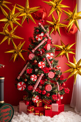 Fototapeta na wymiar Christmas tree in red decorations
