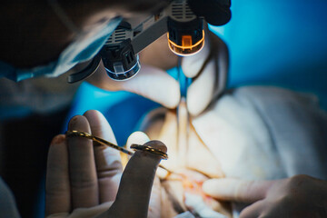surgical flashlight on the surgeon's face, the concept of professional surgical equipment.