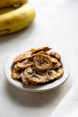 Banana chips. Homemade organic dried banana healthy snack