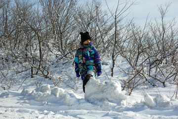 child playing in snow