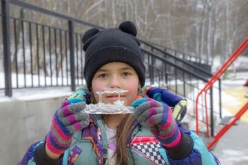 child playing with snow