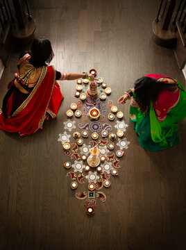 Women decorating for Diwali 