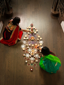 Women decorating for Diwali 