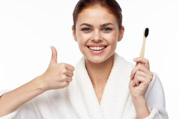 Woman in white coat toothbrush oral hygiene