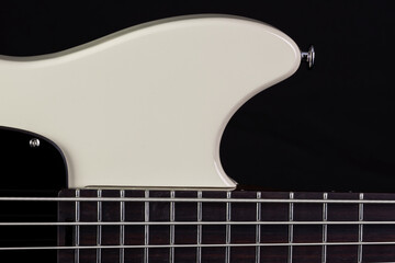 front body of a white electric bass on black background