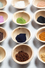Set of natural pigment powder from herbs in small bowls. Dye from nature.