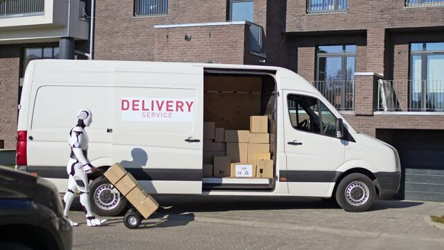 Robot with a trolley going to a van with parcel boxes to deliver them to recipient. Courier delivering parcel box to recipient.
