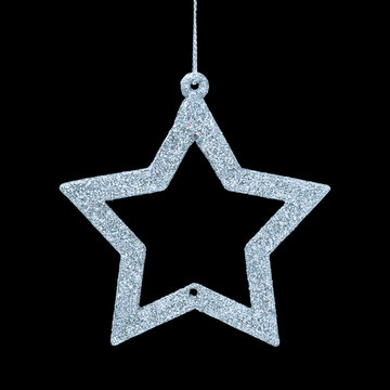 Silver star is isolated on a black background. Christmas and Winter collection