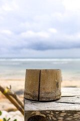 bamboo cup at a wooden table at the beach