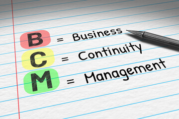 BCM - Business Continuity Management. Business acronym on note pad.
