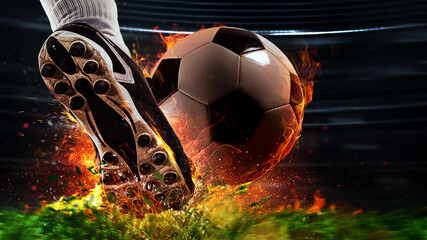 Powerful kick of a soccer player with fiery ball - obrazy, fototapety, plakaty