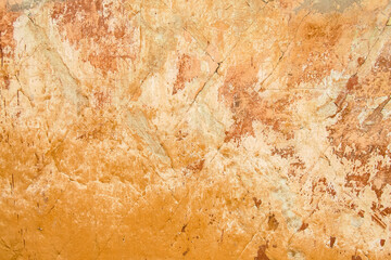 Old shabby plaster wall motley light brown