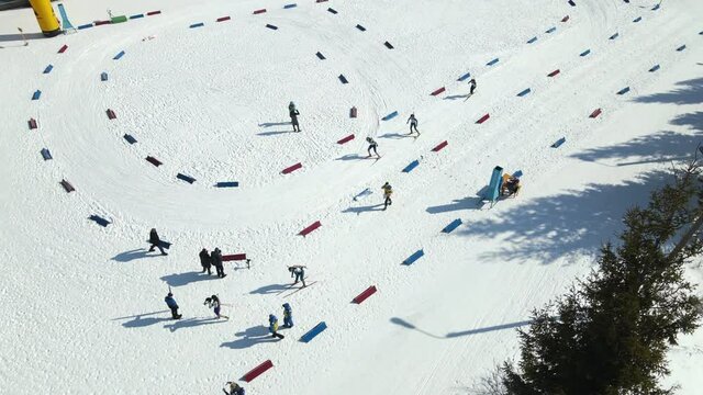 Top view of an athlete who runs a distance on skis and finishes. Winter sports entertainment in the mountains.