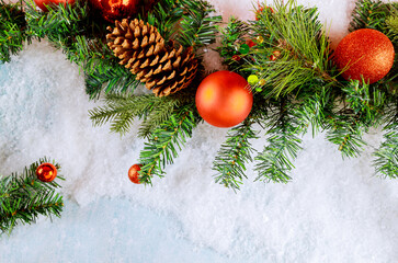 Obraz na płótnie Canvas Red Christmas ball on a Christmas tree with the snowflake background