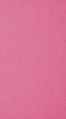 Pale red-violet cardboard surface. Paper texture with cellulose fibers. Mobile phone wallpaper. Vertical light red background with a pastel tint. Textured pacific pink backdrop. Macro