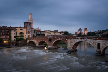 The famous Stone Bridge (Ponte di Piettra) over Adige river in Verona old town at sunrise, Verona,...