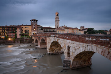 The famous Stone Bridge (Ponte di Piettra) over Adige river in Verona old town at sunrise, Verona,...