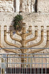 The huge traditional and state-owned menorah in the Western Wall plaza in Jerusalem, a huge...