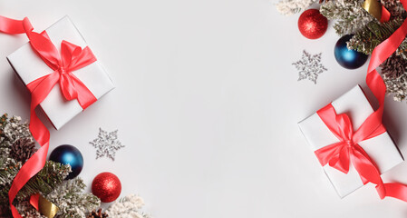 Christmas composition. Christmas gift, pine cones and fir branches isolated on white background.