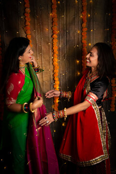 Women admiring silk sari 
