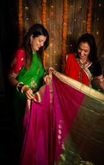 Women admiring silk sari 