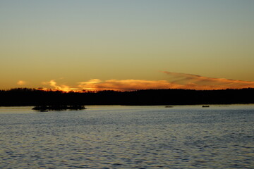 Naklejka premium sunset over the river