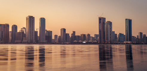 The tallest towers in the Emirates and their reflection on the lakes at night, Dubai, Sharjah