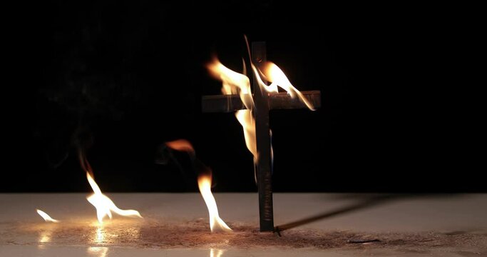 Fire around a burning cross symbol