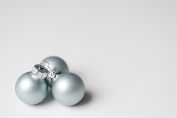 Light blue cosmic balls for Christmas decoration on white background.