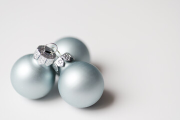 Light blue cosmic balls for Christmas decoration on white background.