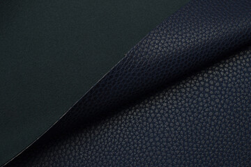 blue artificial leather with waves and folds on PVC base