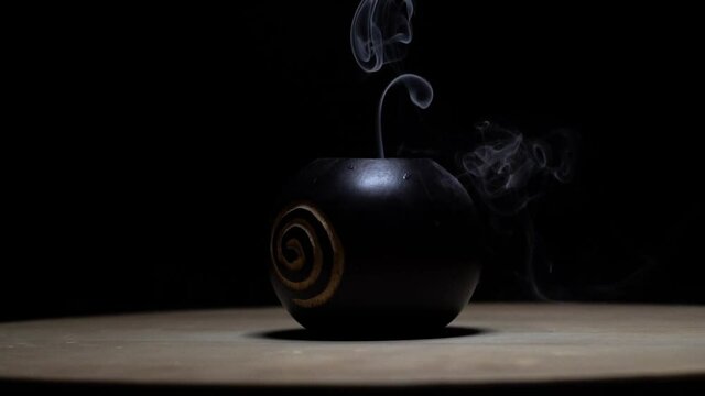 Rotating Object in front of black Background. 4k and slowmotion