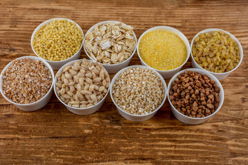 Large group of wholegrain food shot on rustic wooden table
