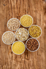 Large group of wholegrain food shot on rustic wooden table