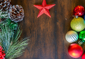 Top Image of Holiday Decorations and Lone Star on Wooden Table