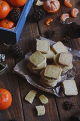 Orange and vanilla shortbread cookies on the christmas background
