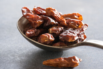 Dried Birdseye Chili Peppers on a Vintage Spoon