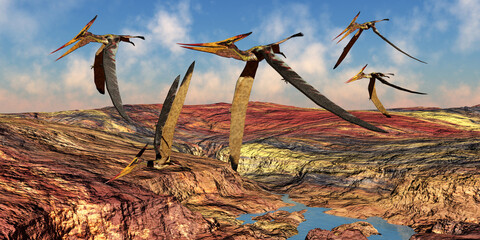 Pteranodon Reptile Flock - Pteranodons reptiles fly over a mountainous landscape in the Cretaceous Period of North America. © Catmando