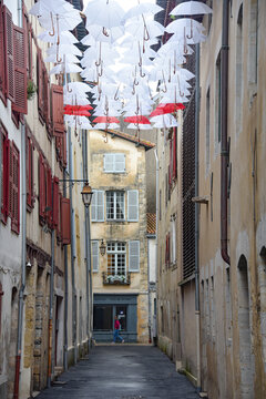 Bayonne, France - 30 Oct, 2021: Umbrella art installment in Rue Marsan, Bayonne, Aquitane