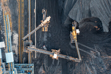 Territory of the coal terminal with coal dumps and a regenerator. loading and unloading of coal by...