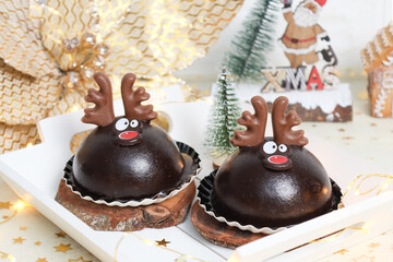 Chocolate cake deer in a white tray.